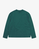 Full flat view of the Uskees green organic cotton long-sleeve T-shirt for men, showing the breast pocket, mini branding label and loose silhouette.