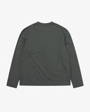 Back view of the Uskees dark green organic cotton jersey long-sleeved T-shirt with loose silhouette.