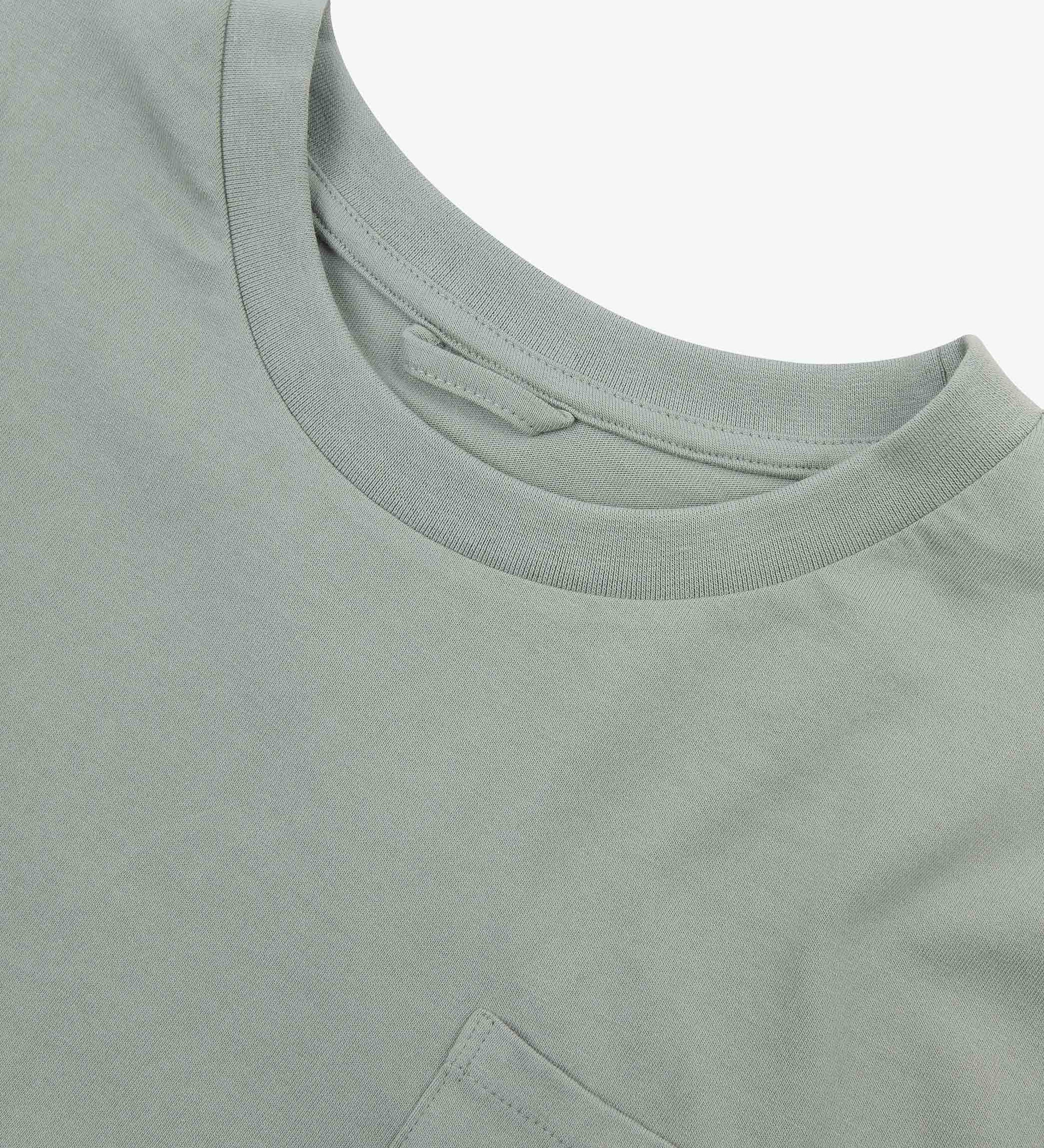 Neckline close-up of Uskees grey-green 'steel' coloured organic cotton long-sleeve T-shirt showing hanging loop and pocket.