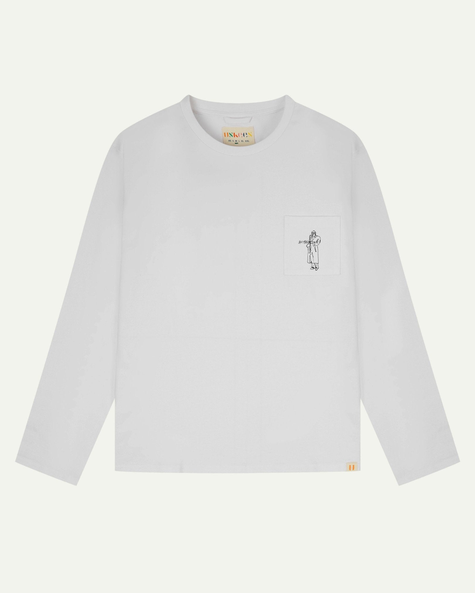 Full flat view of white organic cotton Uskees long-sleeve T-shirt for men, showing the small black 'Jazz Man' logo on the breast pocket and the Uskees branding labels on the neck and hem.