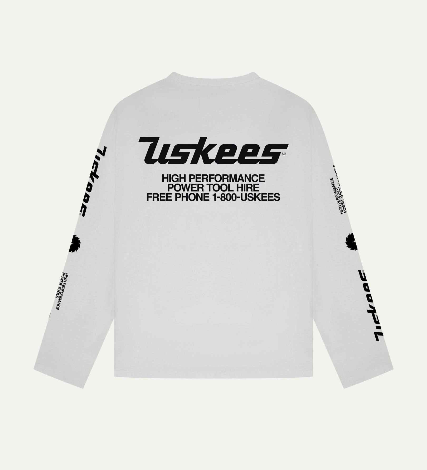 Reverse view of Uskees men's long-sleeve graphic t-shirt in white showing large 'Uskees Power Tools' motif on back.