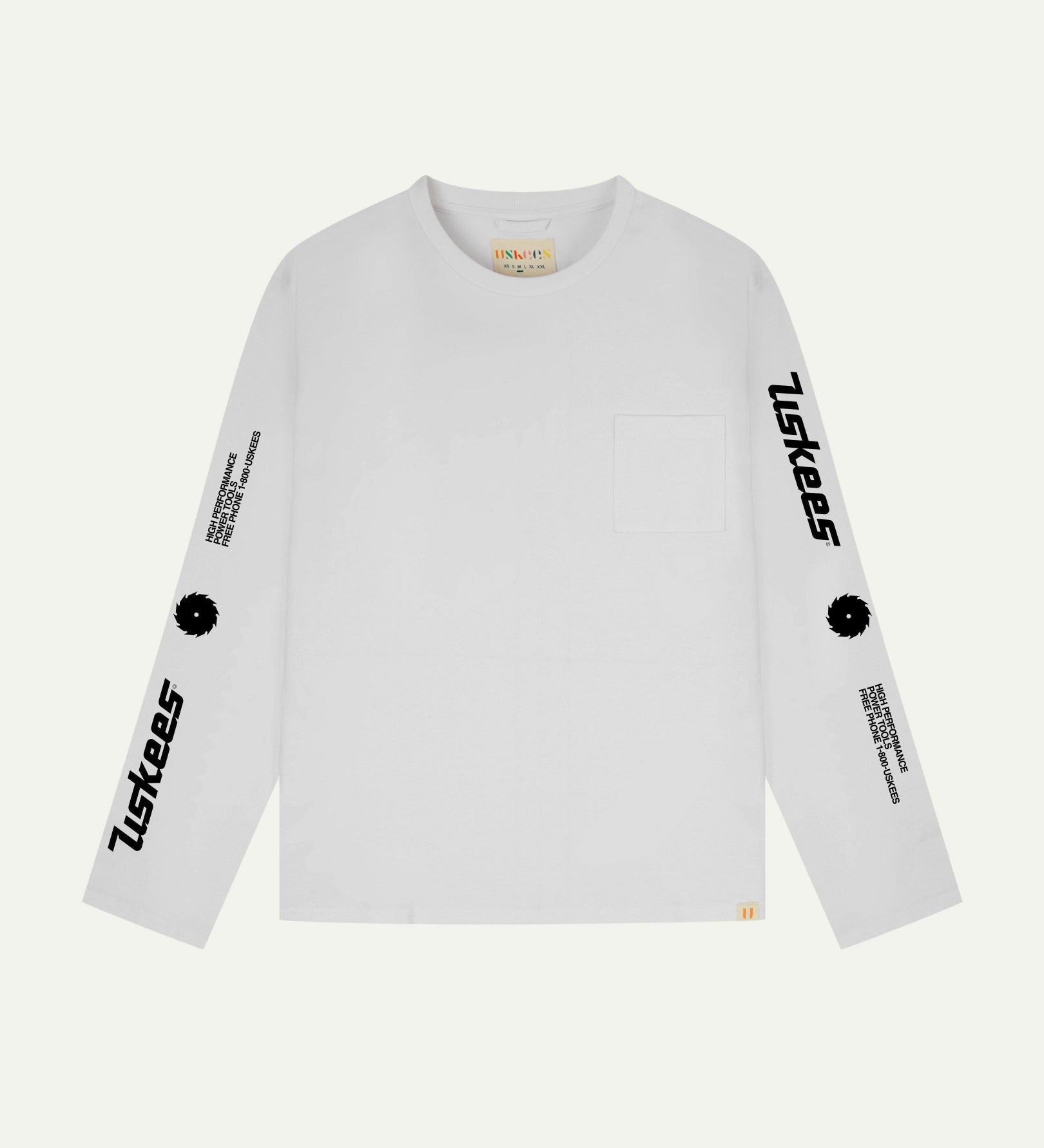 Front flat view of Uskees men's long-sleeve graphic t-shirt in white showing 'Uskees Power Tools' slogans and graphics on each arm and branding label on neck.