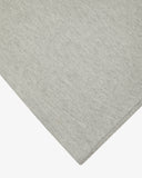 Closer look at the hem of the grey marl organic cotton long sleeve T-shirt showing texture of the medium weight organic cotton jersey.