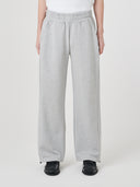 Bottom-half view of model wearing Uskees 7012 gray marl sweatpant, indicating relaxed and wide-leg fit.