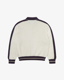 Back flat view of a men's Uskees cream track jacket with purple accents on a white background.