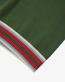 Close-up of an Uskees brown men's tank top with a striped hem featuring red, blue and white colors.