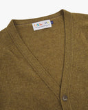 Front view of Uskees olive-green lambswool Harris cardigan with focus on v-neck, corozo buttons and branding label.