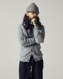 Model wearing stone-grey Harris cardigan.