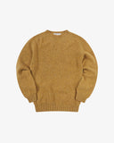 Front flat view of speckled butterscotch, Alderney crew neck jumper in Scottish new wool. Clear view of drop shoulder design Uskees branding label.