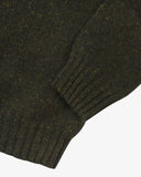 Closer view of Alderney crew neck jumper in Scottish new wool from Uskees. Focus on cuff, hem, multicoloured speckles and wool texture.