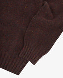 Closer view of Alderney crew neck jumper in Scottish new wool from Uskees. Focus on cuff, hem, multicoloured speckles and Scottish new wool texture.