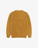 Back view of Uskees lambswool sweater in buckthorn (mustard yellow).