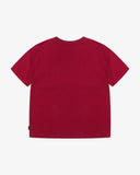 Back view of the Uskees red organic cotton jersey T-shirt showing the loose silhouette.