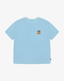 Front view of Uskees light blue men's graphic t-shirt with small USK FC logo on a white background.