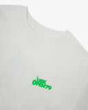 Neckline close-up of white organic cotton T-shirt, with focus on the neck tape reinforcement and green brand graphics.