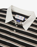 Close up view of an Uskees striped men's rugby shirt showing the black/cream/brown stripes and whie collar.