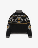 A black knit Uskees cardigan for men with a geometric  pattern in grey and tan, featuring a ribbed collar, cuffs, and hem, shown against a plain white background.