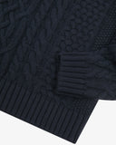 Close up view of Uskees dark blue men's chunky cable knit jumper showing the cuff and welt detail.