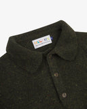 Close up of an Uskees green/brown men's sweater showing the collar, buttoned placket and brand label at neck.