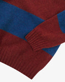 Close up view of Uskees red and blue striped sweater for men showing the cuff and welt detail.