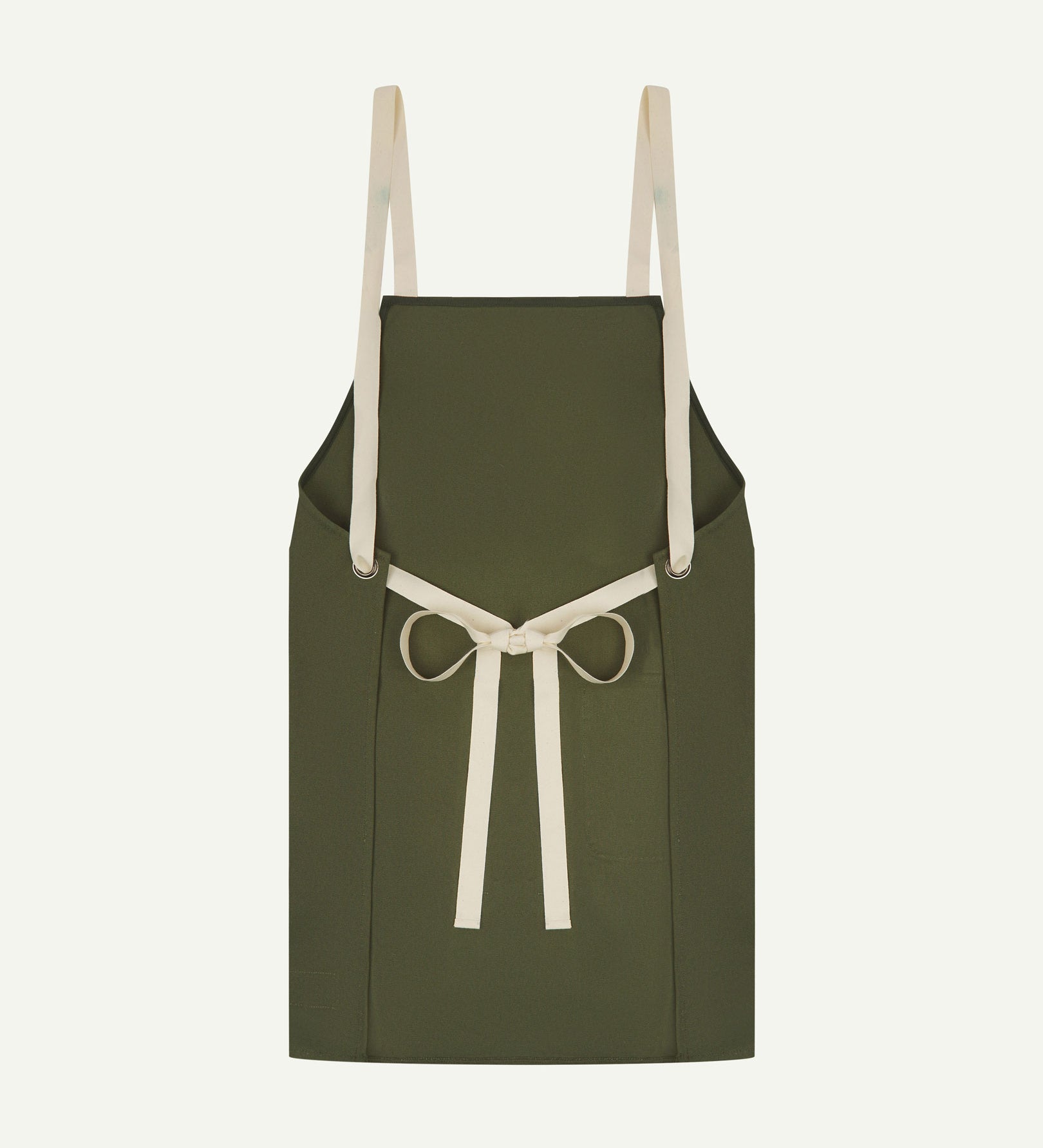 Back flat shot of Uskees unisex green canvas apron showing adjustable cream straps.