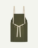 Back flat shot of Uskees unisex green canvas apron showing adjustable cream straps.