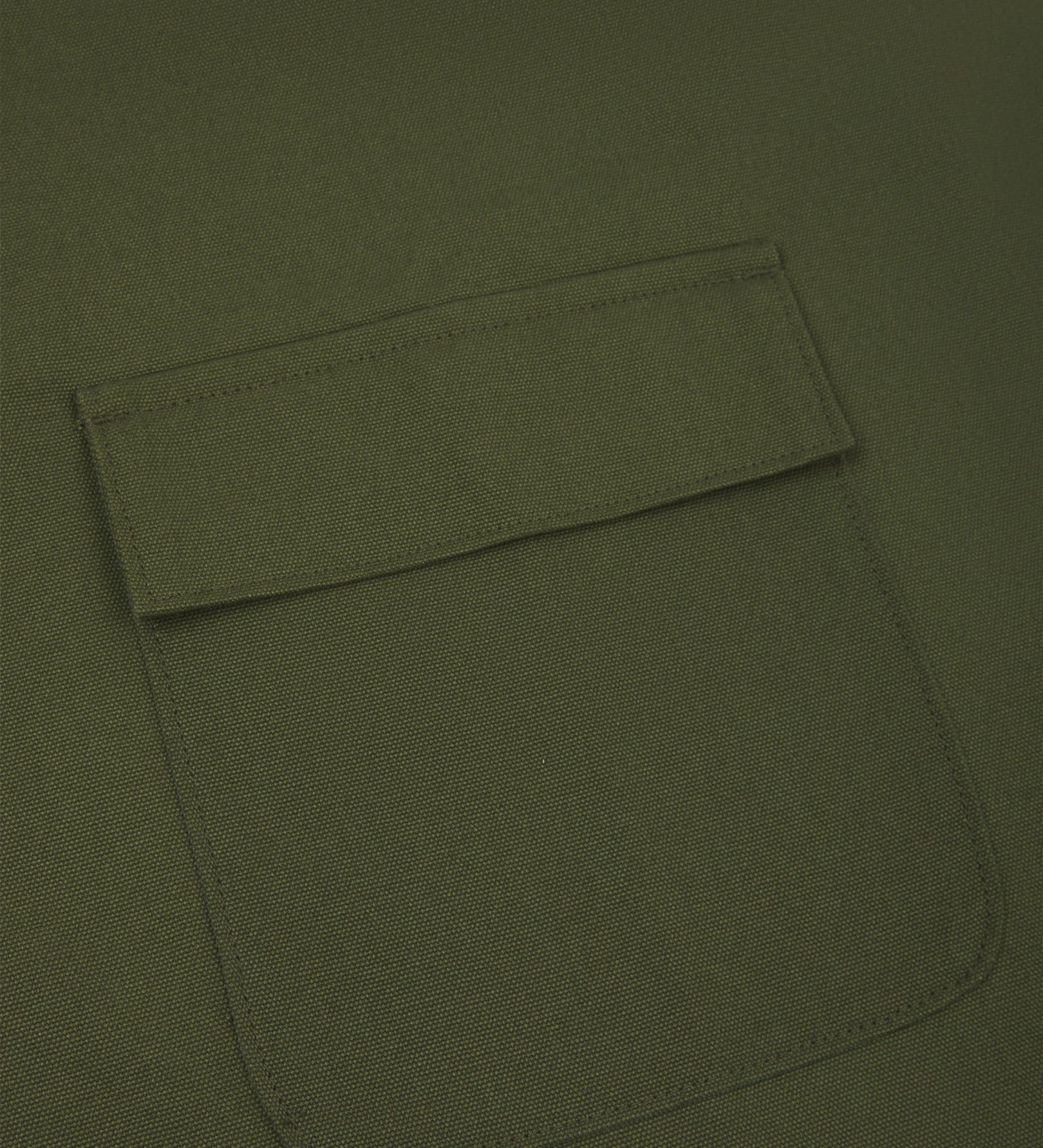 Close up shot of Uskees green canvas apron showing front flap pocket.