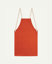 Flat shot of Uskees gold-orange canvas apron showing cream straps and front pocket.