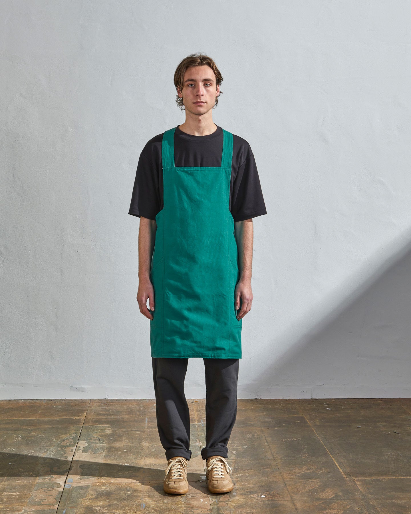 Full-length, front view of model wearing Uskees #9003 foam green Japanese style apron by Uskees.