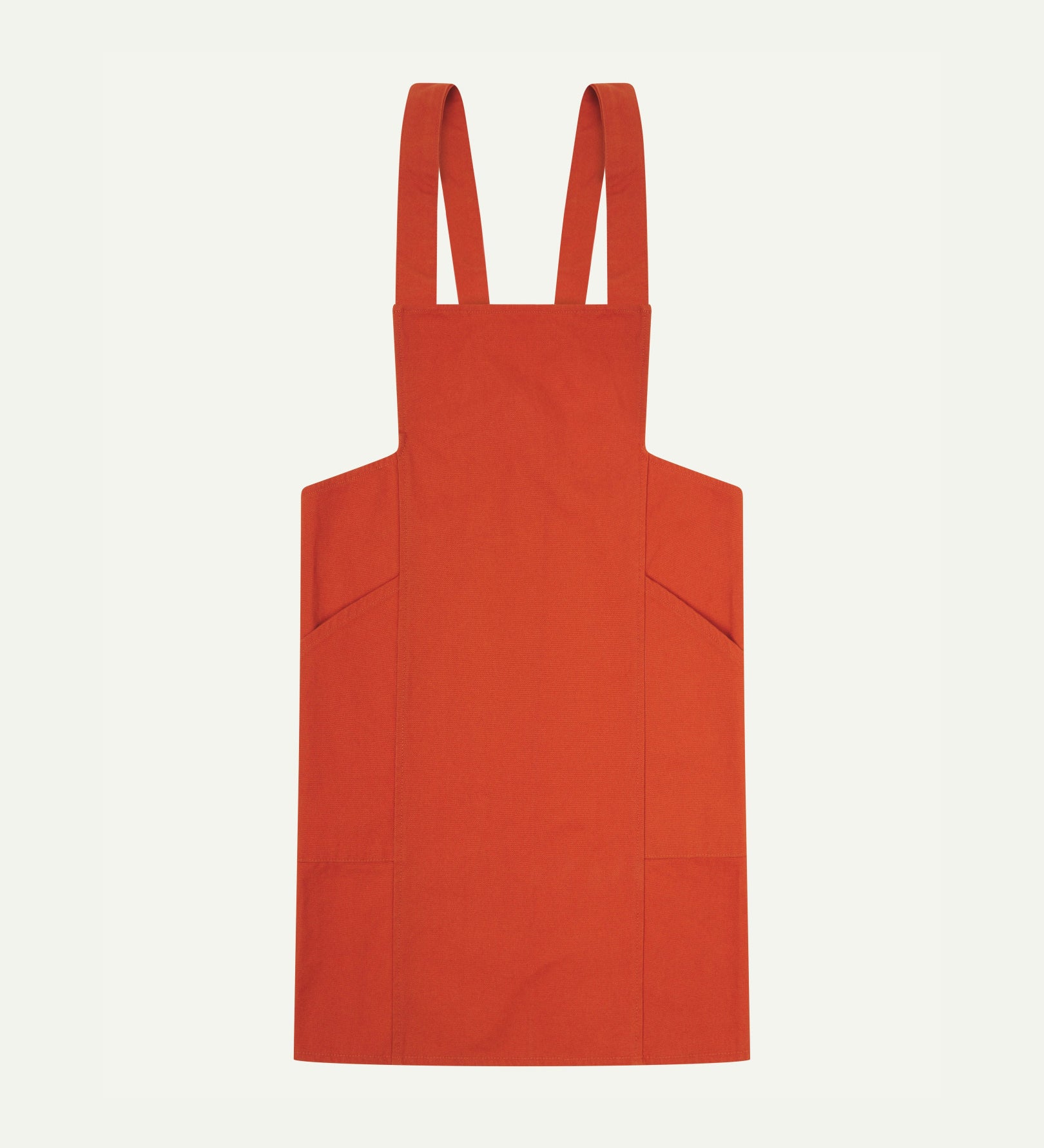 Flat shot of Uskees Japanese-style 9003 gold-orange canvas apron showing straps and two side pockets.