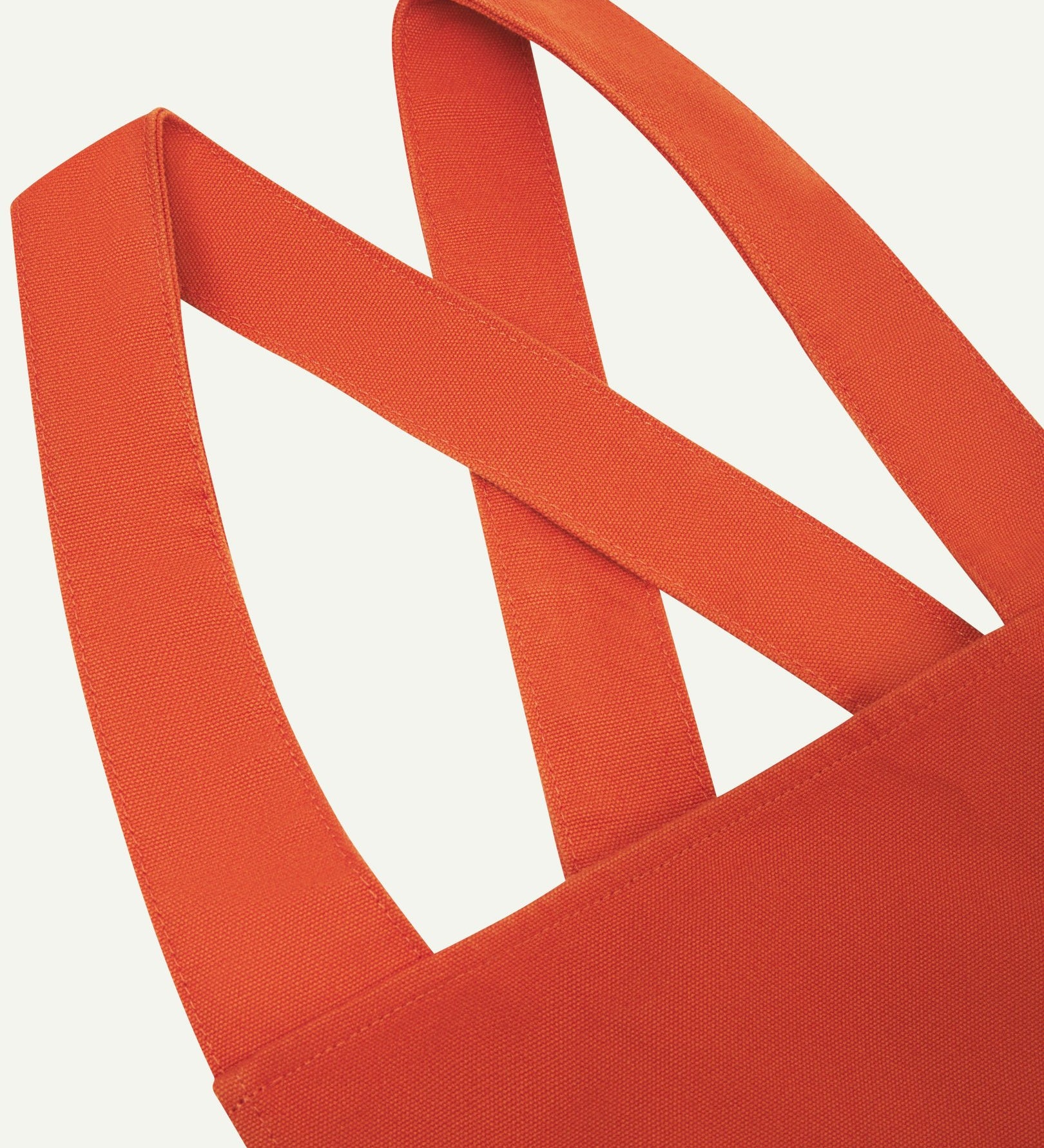 Closer angled view of Uskees Japanese-style 9003 gold-orange canvas apron straps.