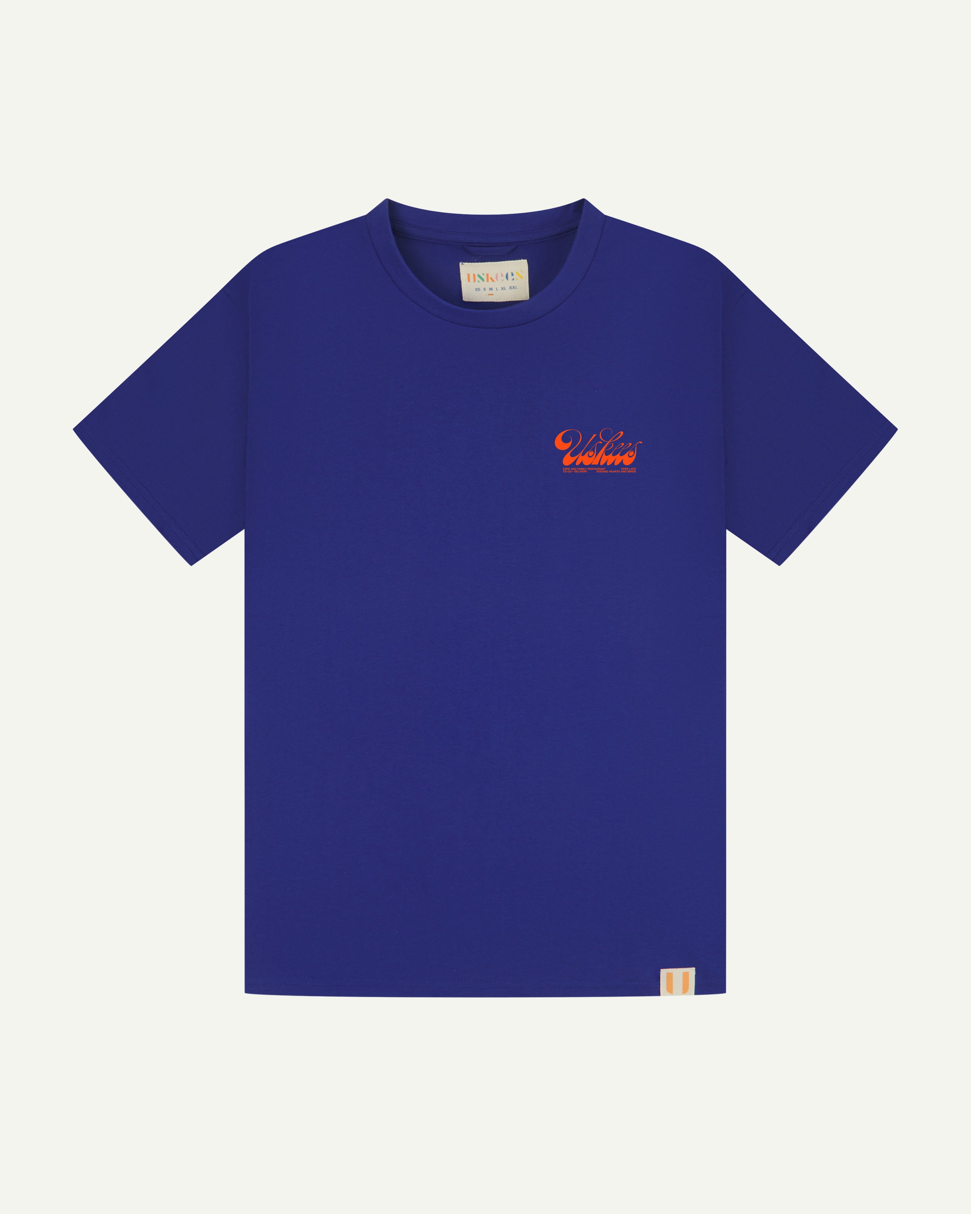 Front flat shot of the uskees men's graphic Tee in ultra blue showing the 'diner' logo in orange