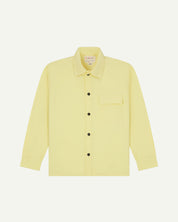 Front-view of pale yellow buttoned lightweight overshirt from Uskees. Clear view of breast pocket, black press studs and sharp detailing.
