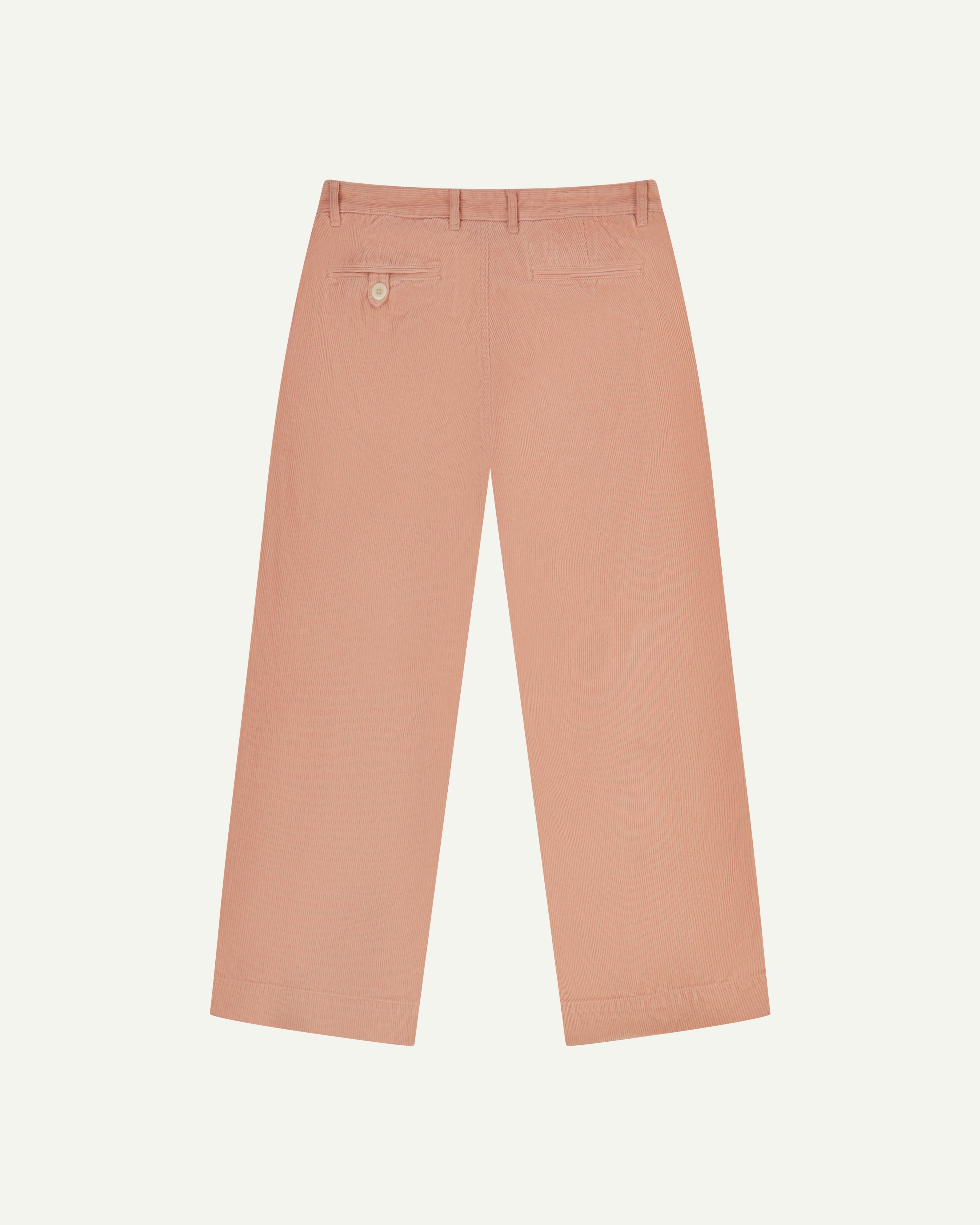 Back view of #5018 Uskees men's organic corduroy boat trousers in dusty pink showing wide leg style and buttoned back pocket.