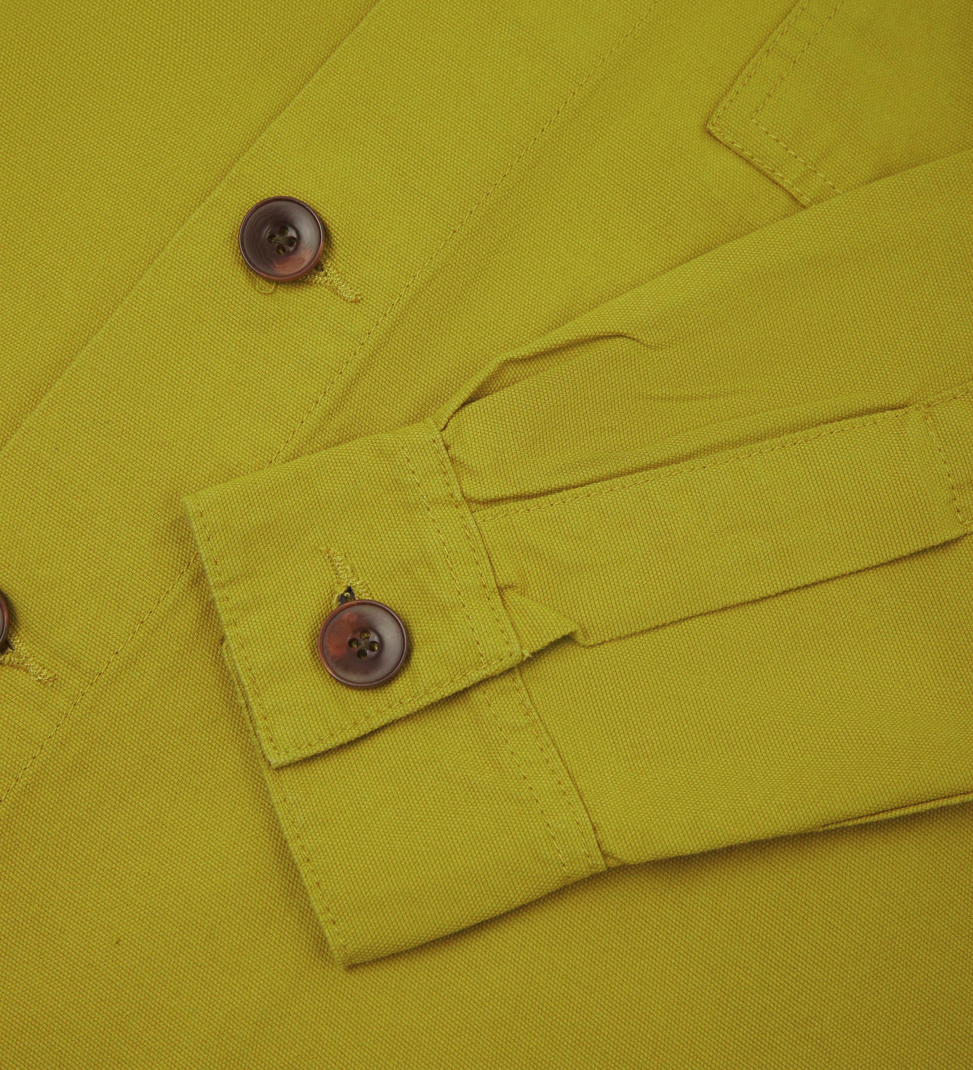 Front close up shot of uskees pear green workshirt for men showing buttoned cuff