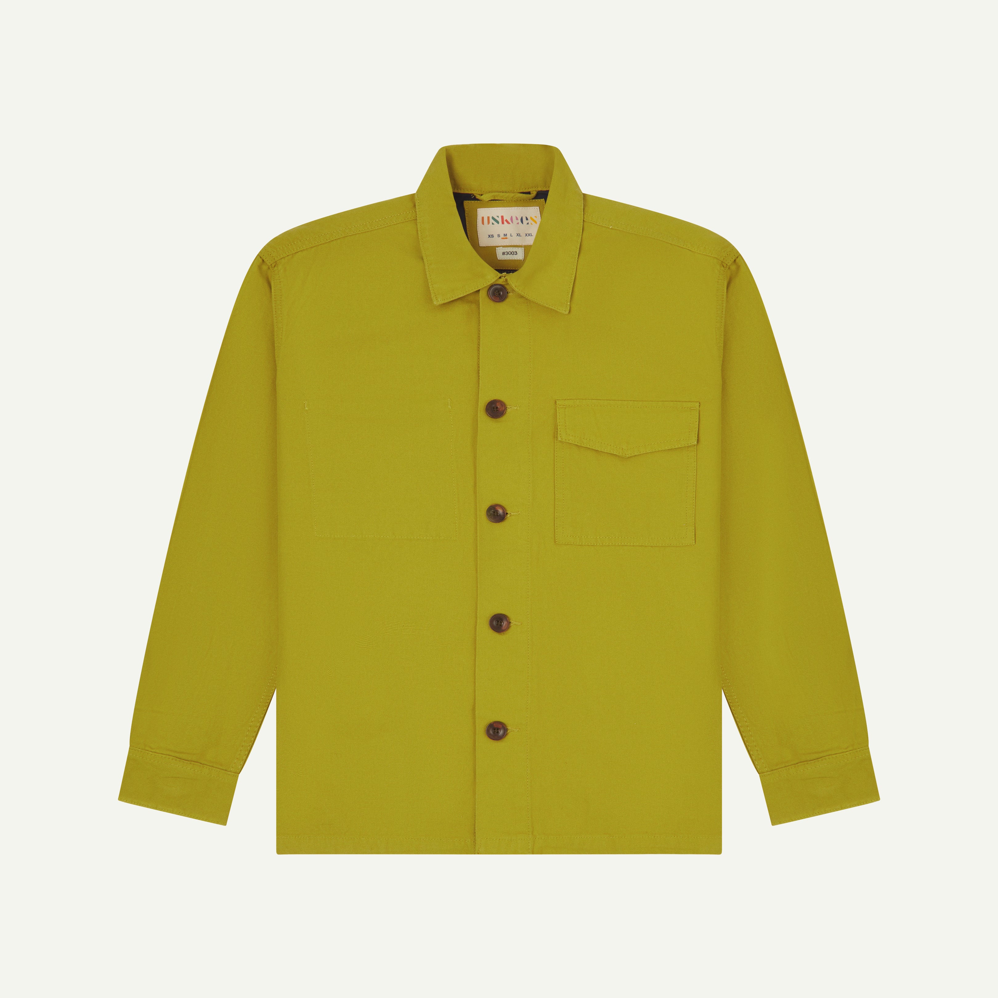 Front flat shot of uskees pear green workshirt for men showing brand label at neck