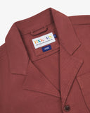 Close-up top-half view of #3006, chestnut-brown organic cotton-drill blazer. With focus on collar, lapels, Uskees brand label and corozo buttons.