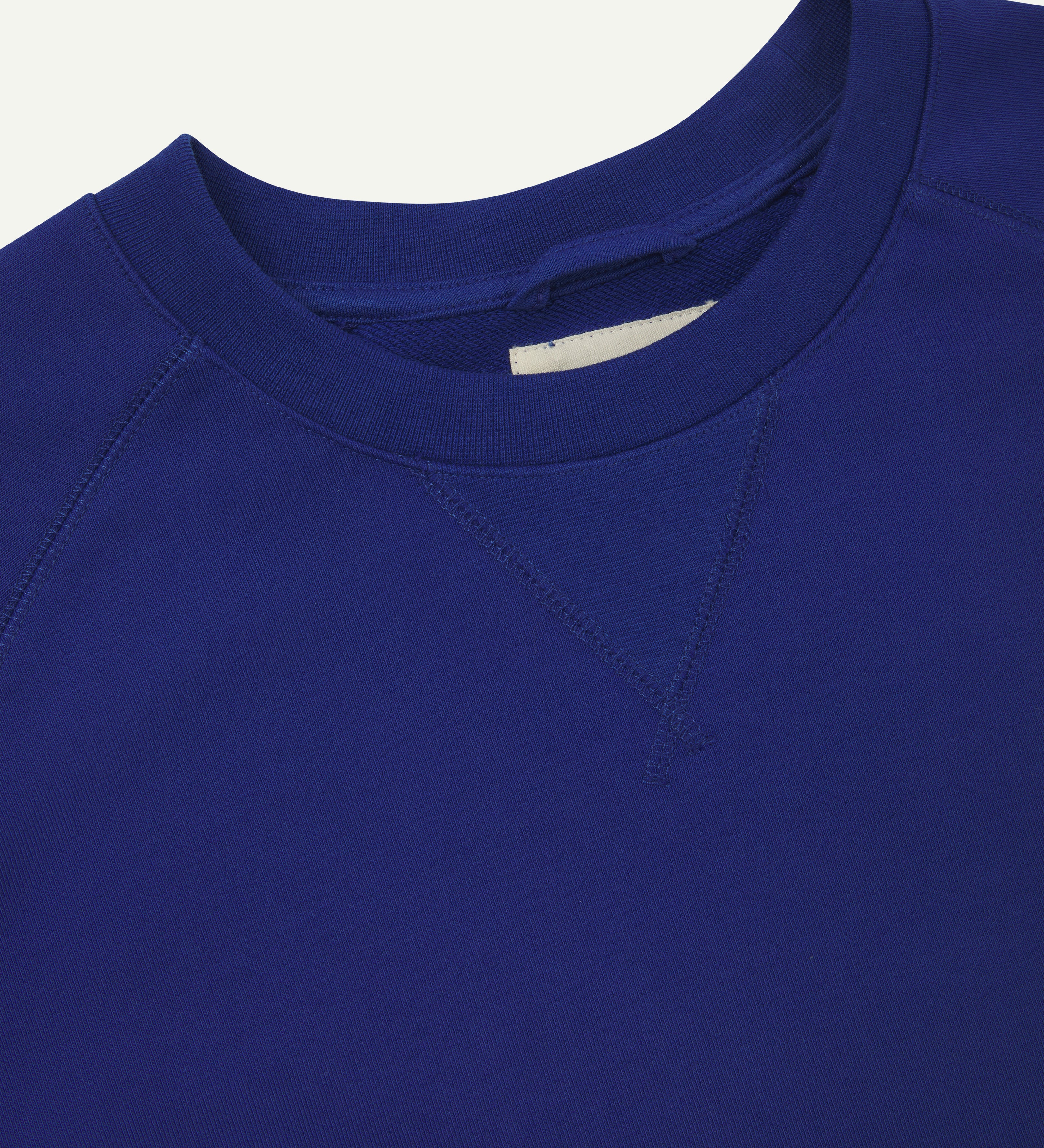 Front view of bright blue men's organic heavyweight cotton #7005 sweatshirt showing collar detail.
