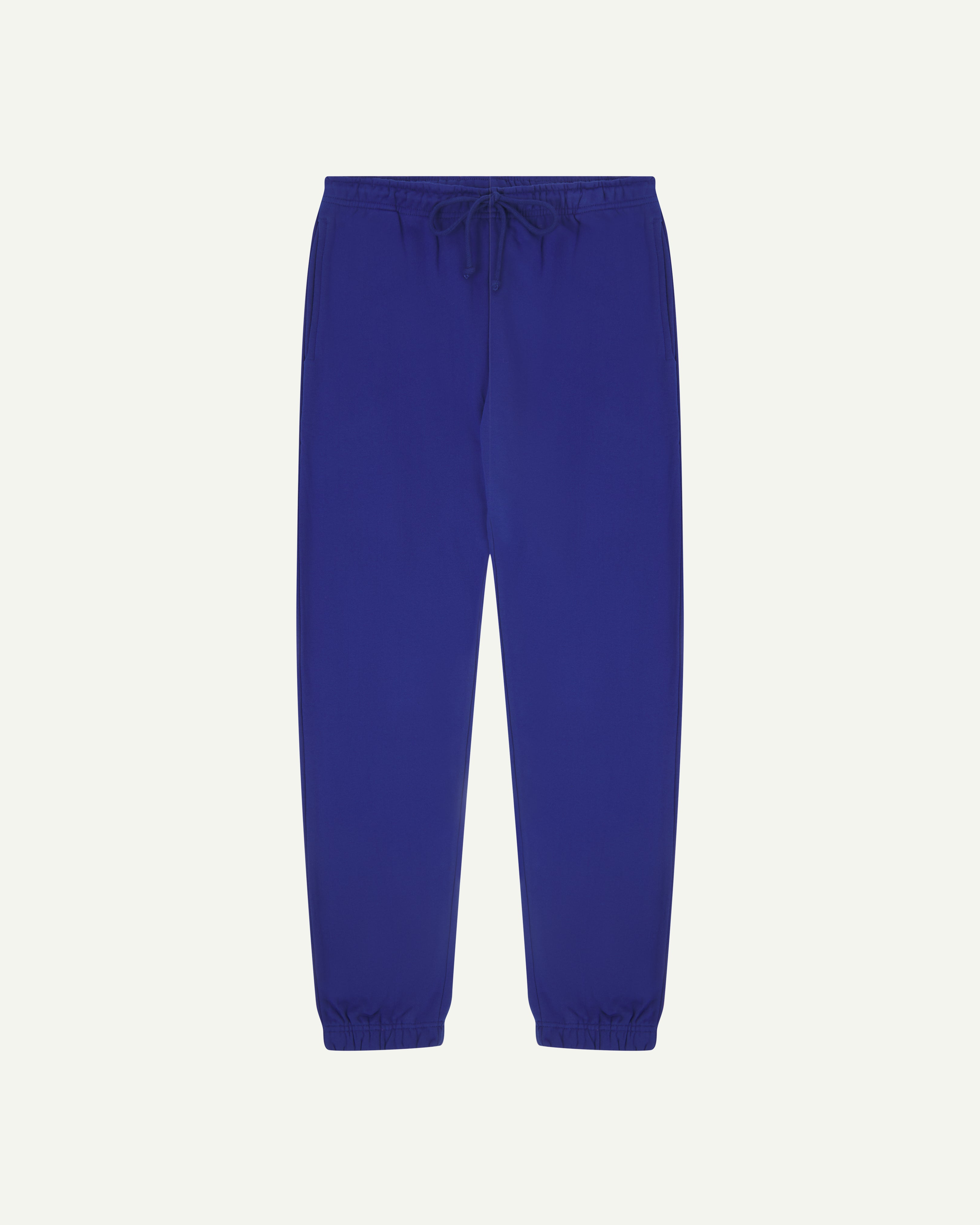 Front view of bright blue organic cotton Jogging Pants for men by Uskees.