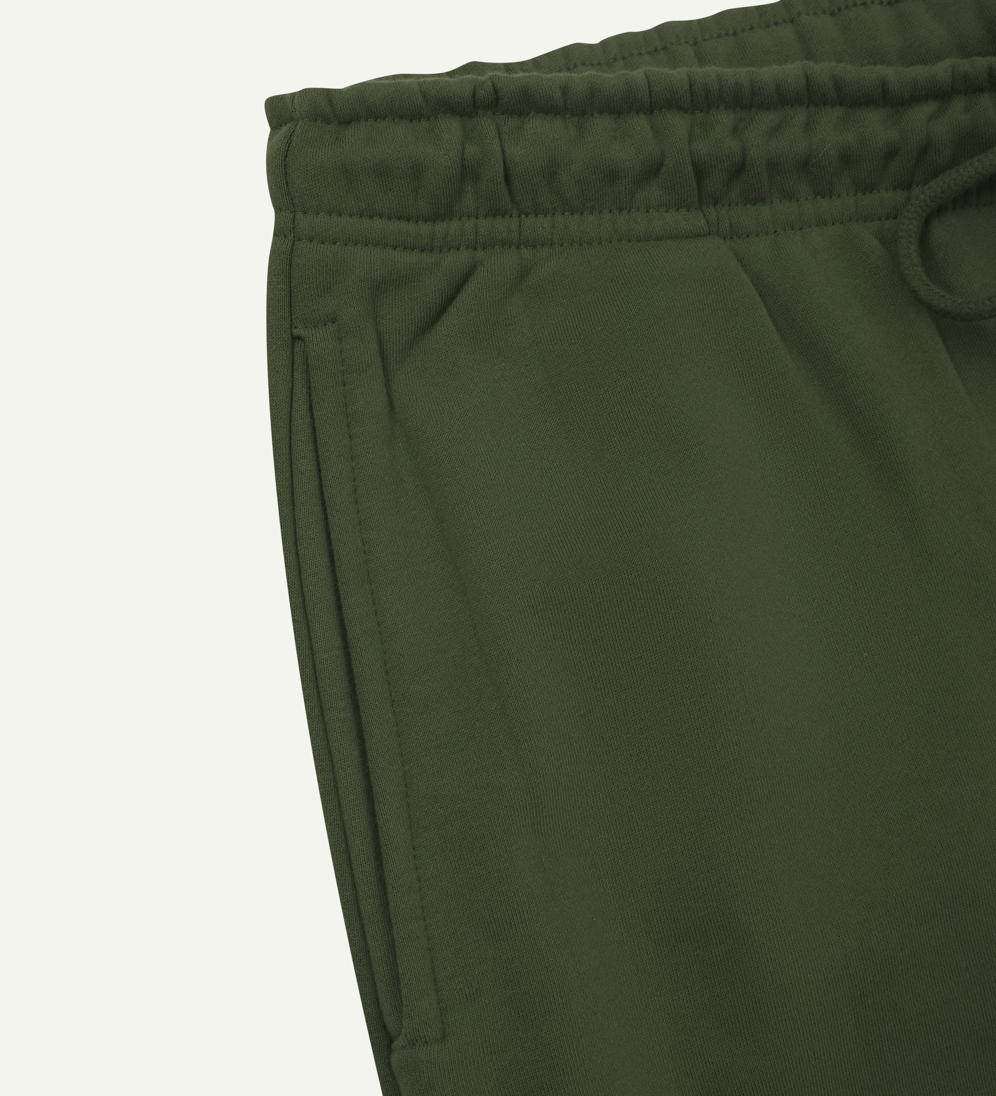 Close up view of organic cotton Joggers for men by Uskees showing the side pocket and drawstring waist.
