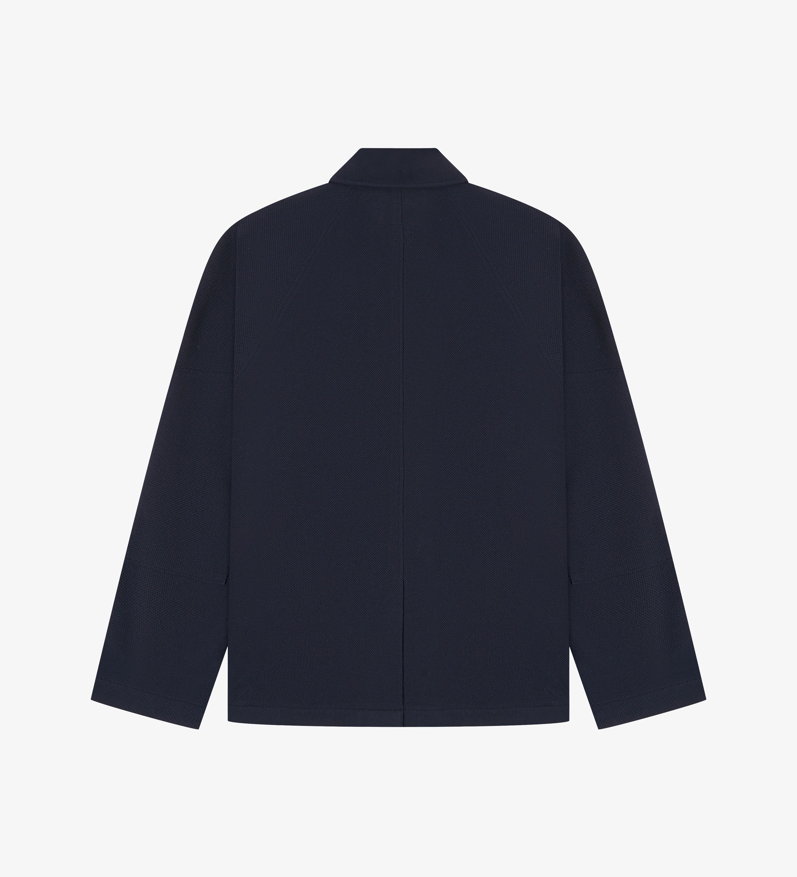 Flat back view of knitted organic cotton midnight blue blazer from Uskees with view of vent and reinforced elbows.