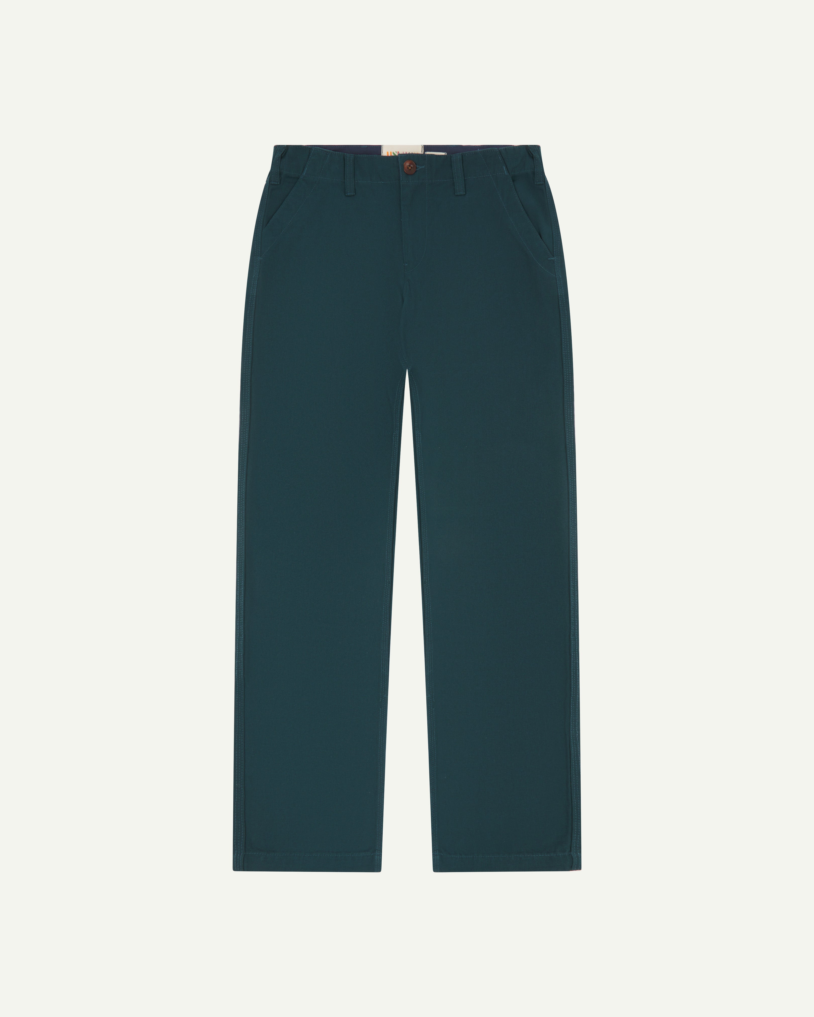 Flat view of #5005 Uskees men's organic cotton 'peacock' coloured trousers on white background.