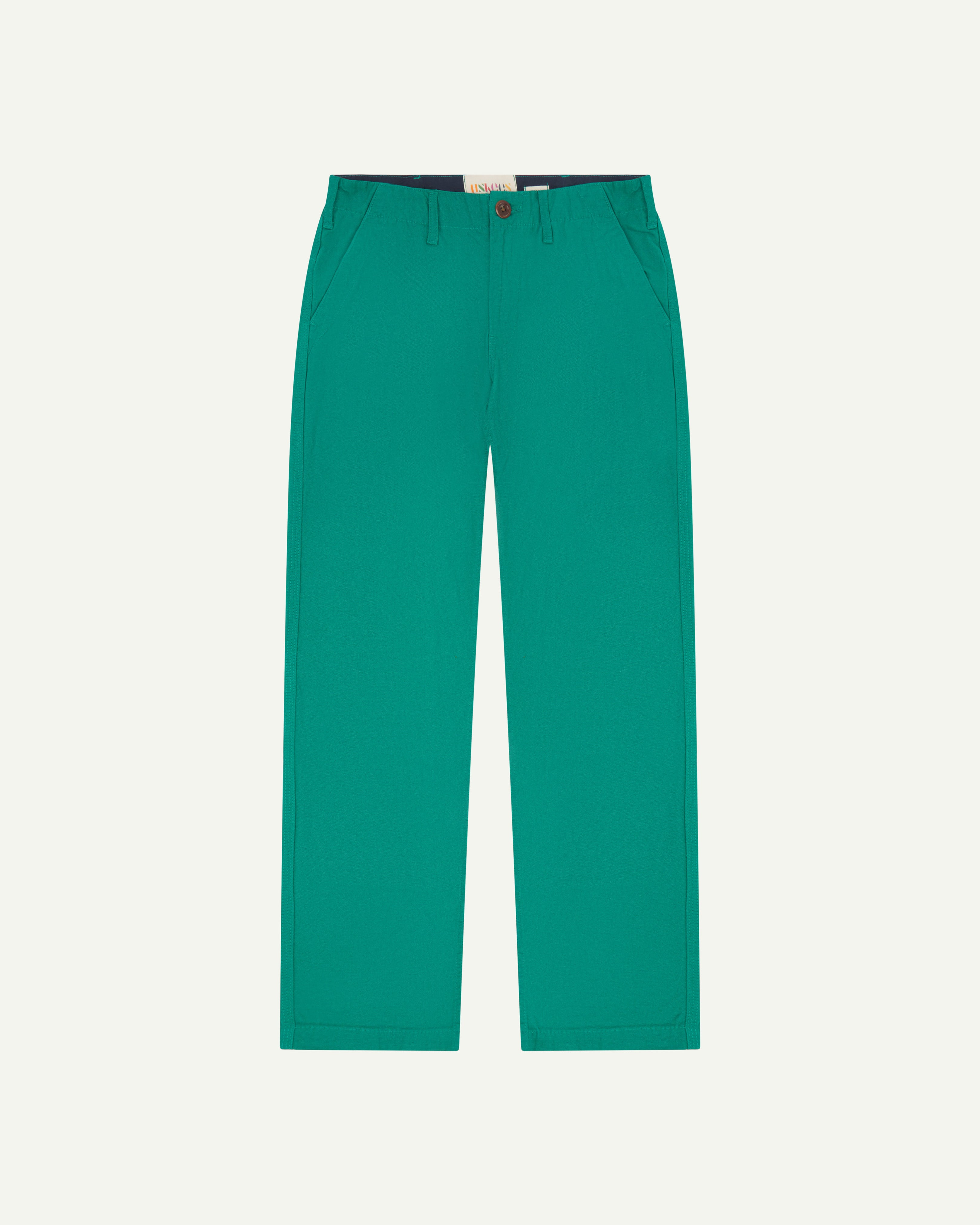 Flat view of #5005 Uskees men's organic cotton 'foam green' coloured trousers on white background.