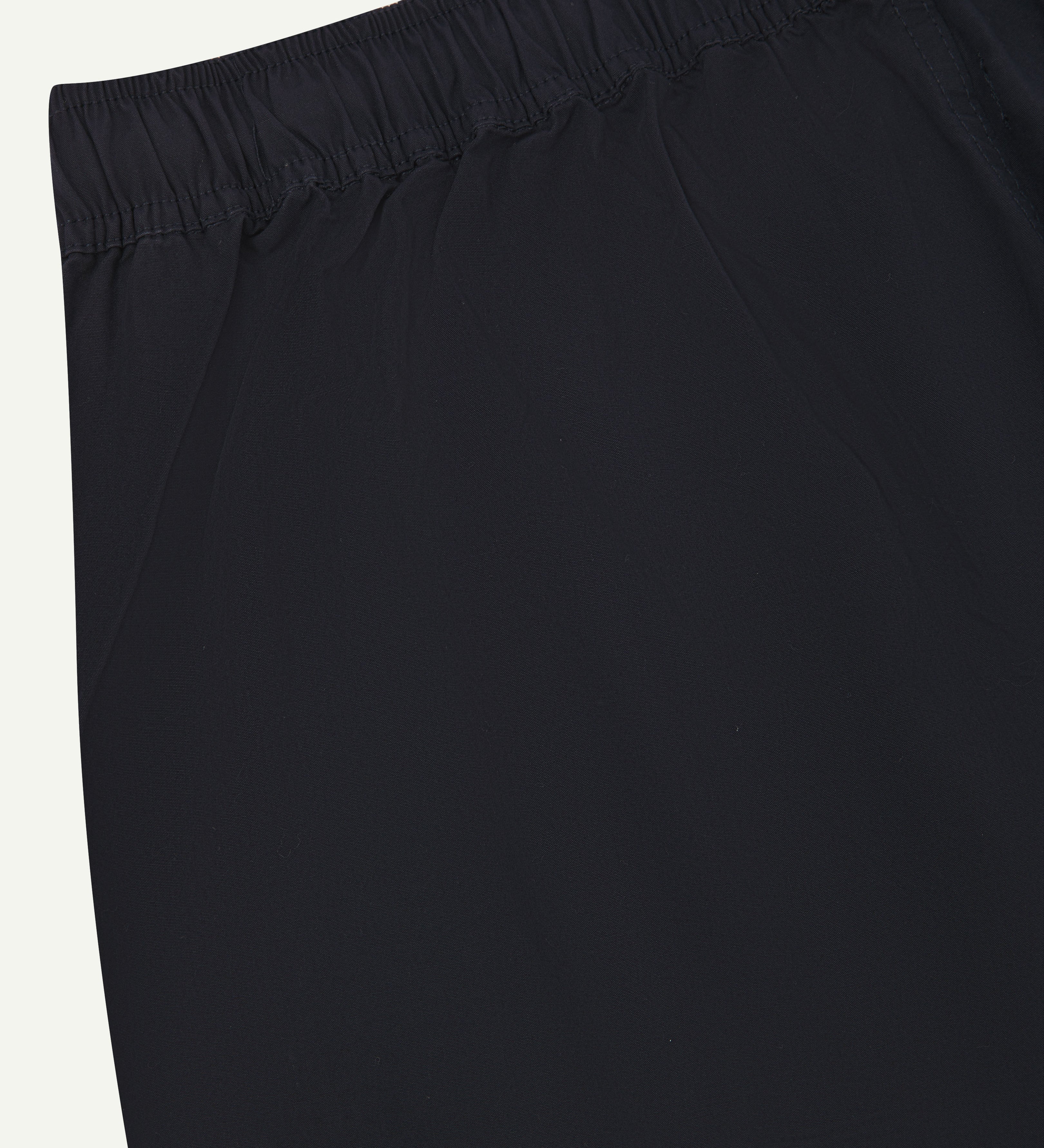 Close up detailed shot of Uskees 5020 midnight blue lightweight utility pants showing elasticated waist