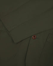 Close up front view of men's vine green blazer from uskees showing sleeve, cuff and corozo button.
