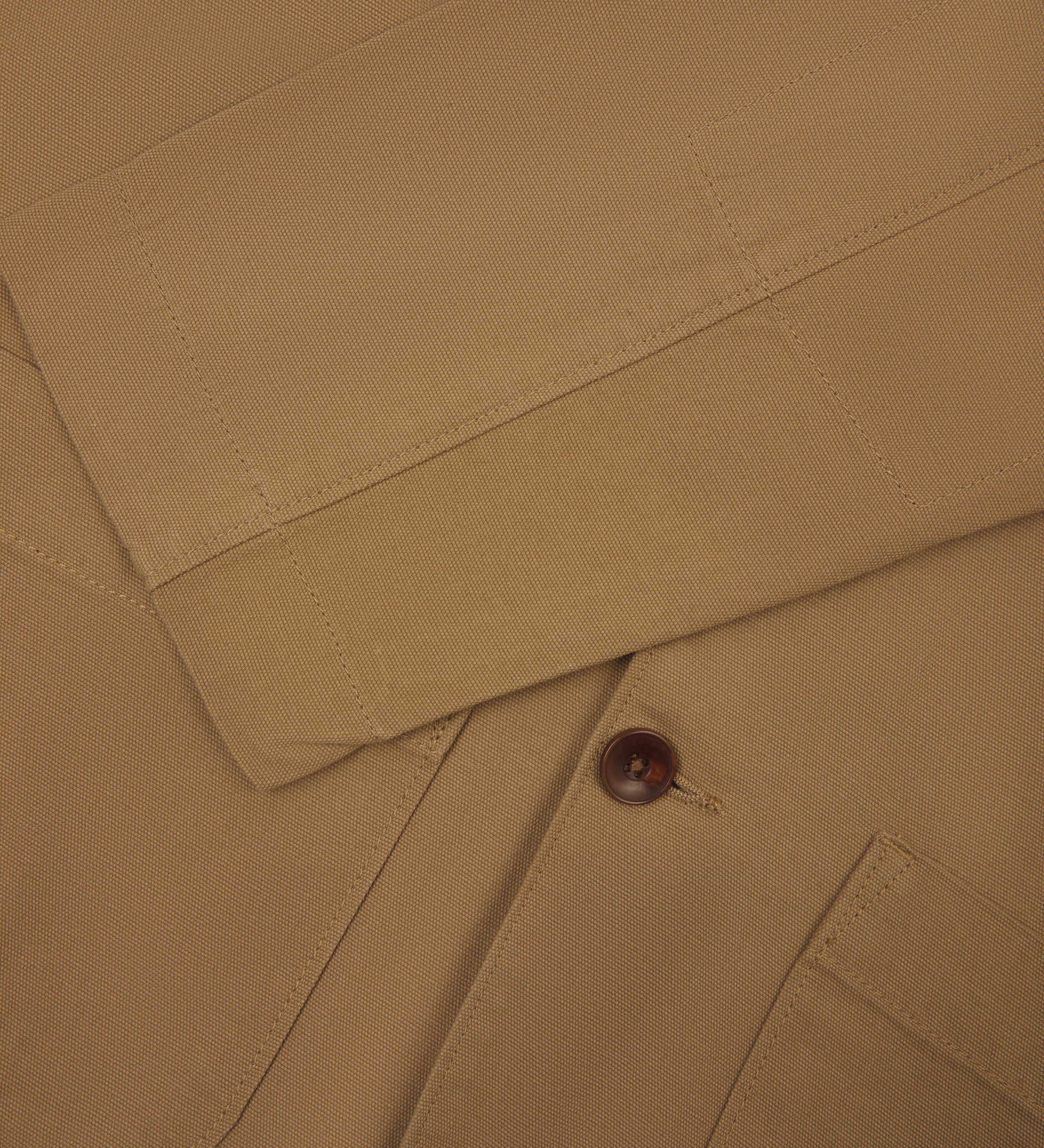 Front flat  close shot of uskees men's khaki organic cotton men's jacket showing front button fastening and sleeve