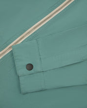 close up shot of Uskees #6002 jacket showing black popper detail on cuff