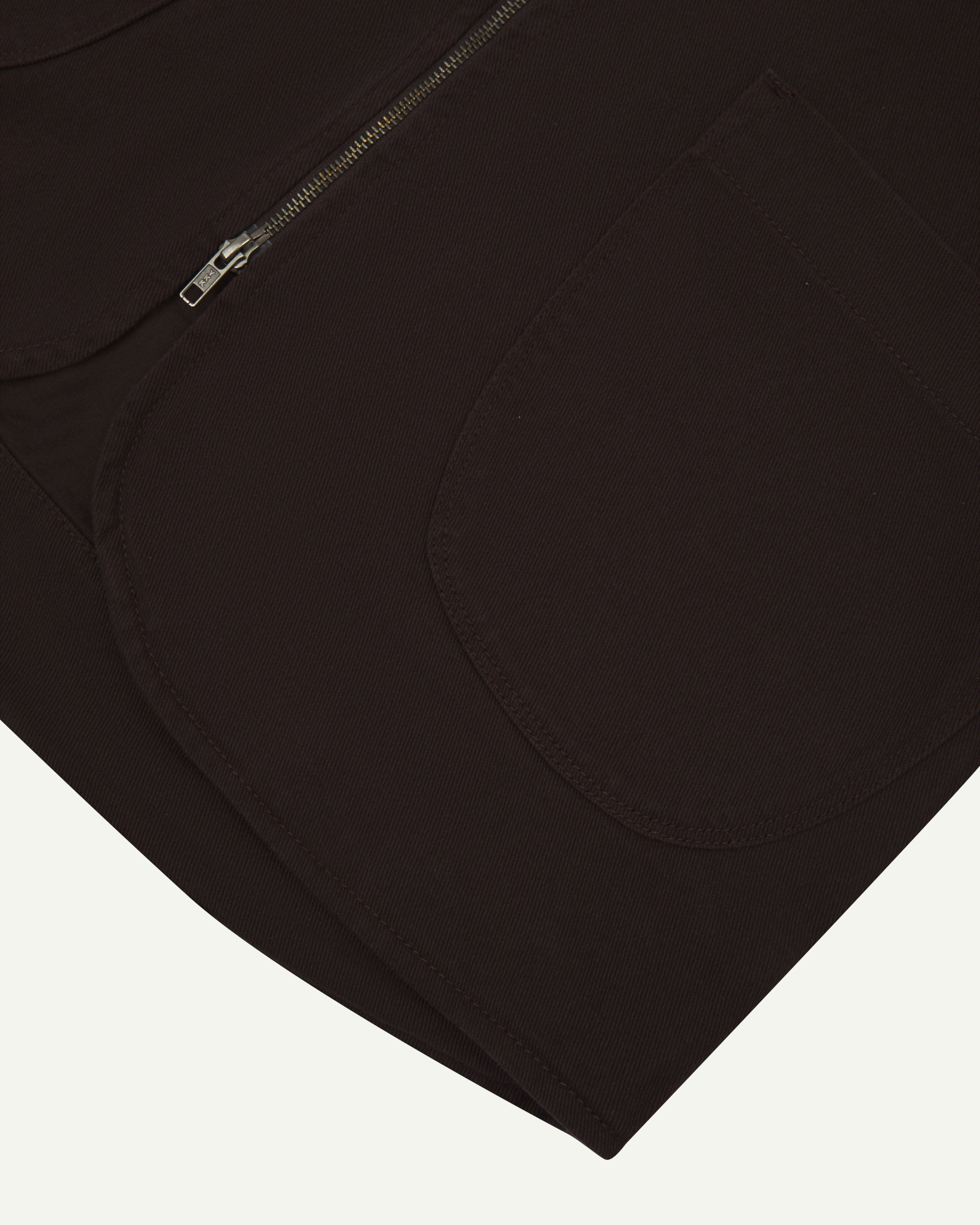 Close up shot of Uskees #3036 dark plum zip front vest showing curved pocket detail