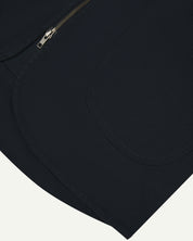 Close up shot of Uskees #3036 blueberry zip front vest showing curved pocket detail