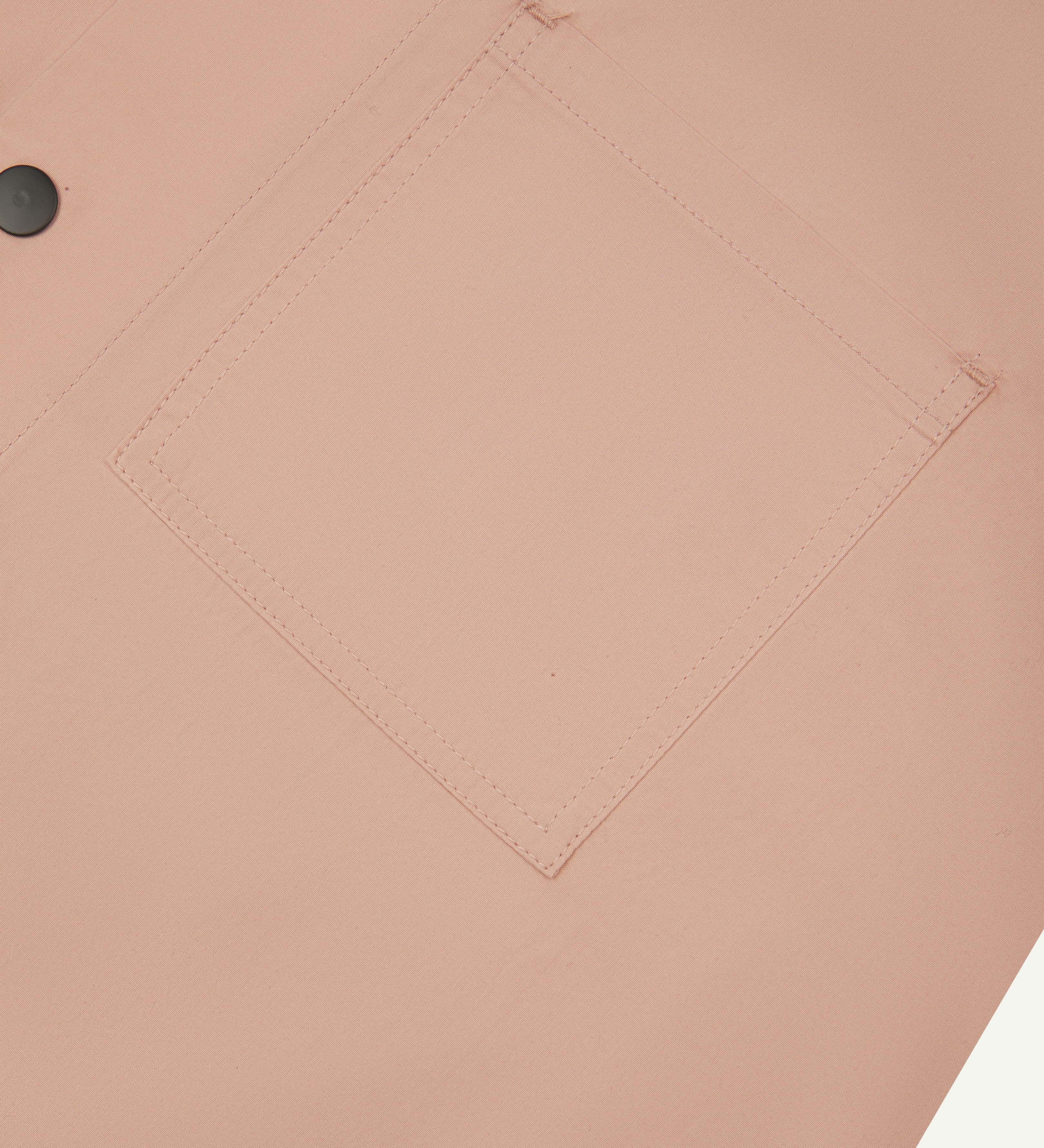 close up shot of uskees dusty pink men's #6003 shirt showing front pocket